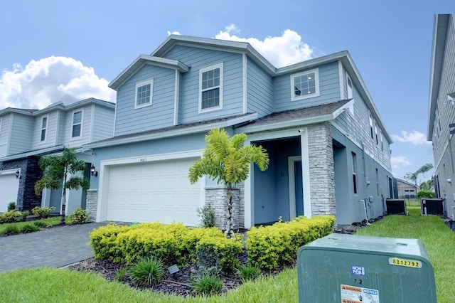 view of front facade with driveway and an attached garage