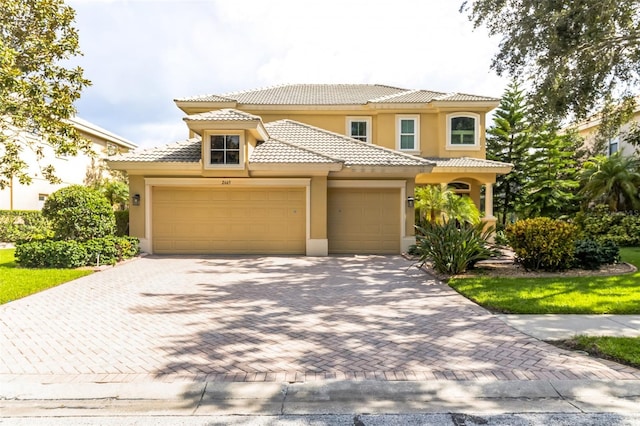 mediterranean / spanish-style house featuring a garage