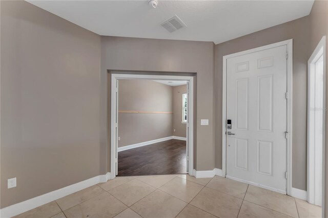 tiled entrance foyer featuring a wealth of natural light