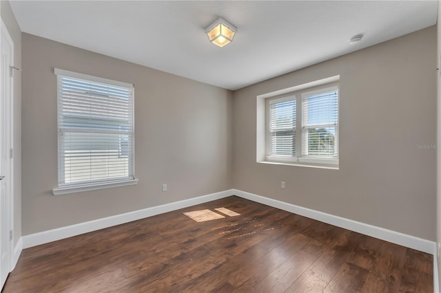 spare room featuring dark hardwood / wood-style floors