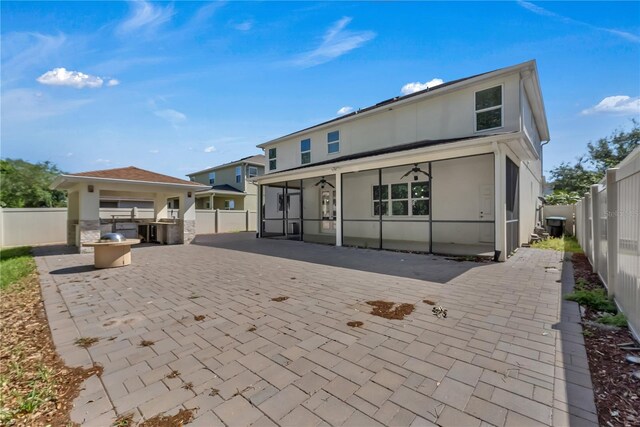 rear view of house with a patio