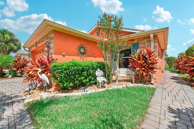 exterior space with a yard and a garage