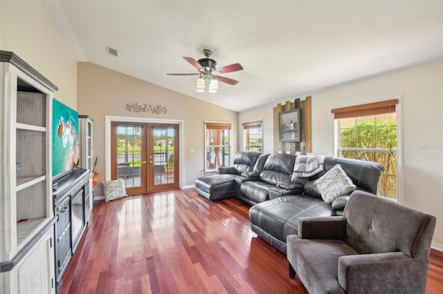 living room with dark hardwood / wood-style flooring, lofted ceiling, french doors, and ceiling fan