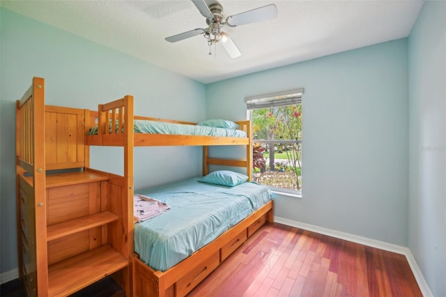 bedroom with hardwood / wood-style flooring and ceiling fan