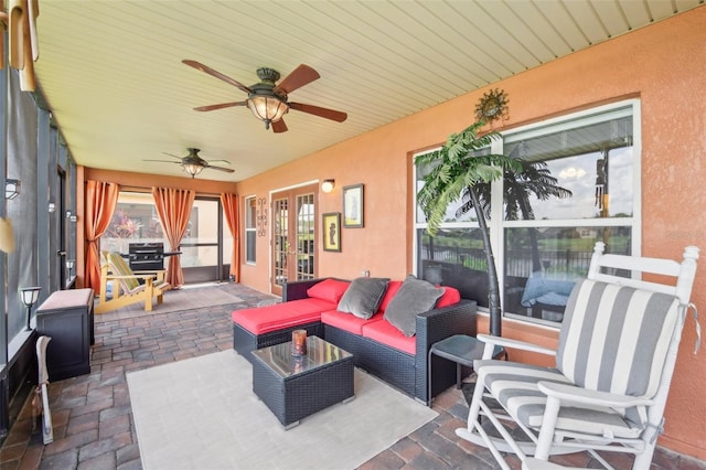 view of patio with french doors, ceiling fan, and outdoor lounge area