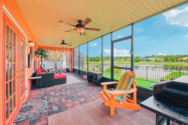 sunroom with a water view