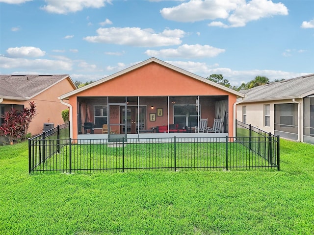 view of front of home with a front lawn and a sunroom