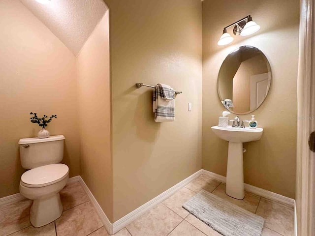 bathroom featuring tile patterned floors and toilet