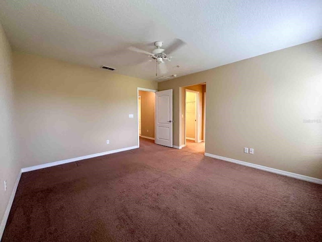 unfurnished bedroom with carpet floors, a textured ceiling, and ceiling fan