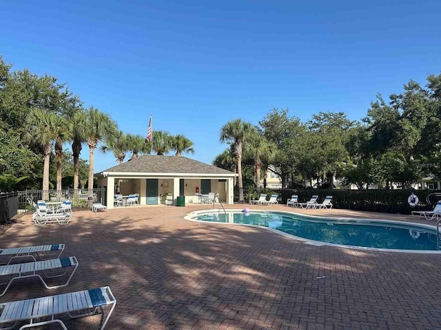 view of swimming pool featuring a patio area