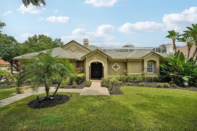 ranch-style house with a front lawn