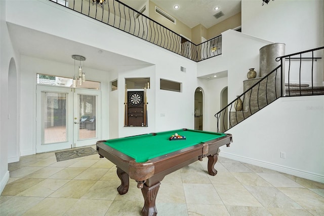 game room with light tile patterned flooring, french doors, a high ceiling, and billiards