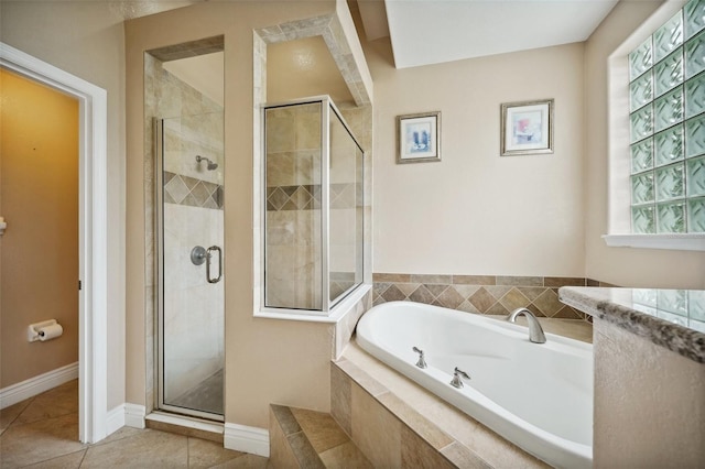 bathroom with tile patterned floors, plenty of natural light, and independent shower and bath