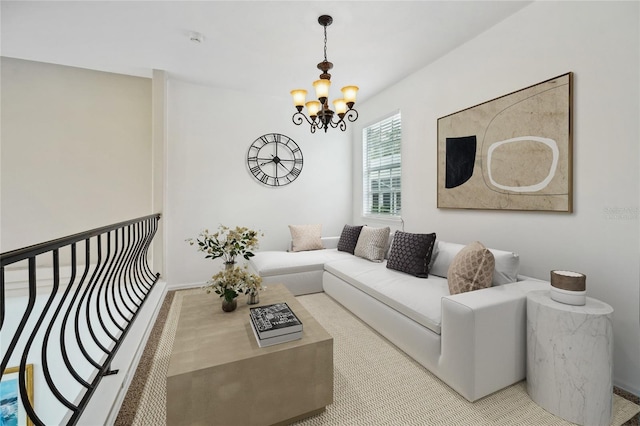 carpeted living room featuring a chandelier