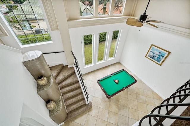 playroom with light tile patterned flooring, pool table, a high ceiling, and a healthy amount of sunlight