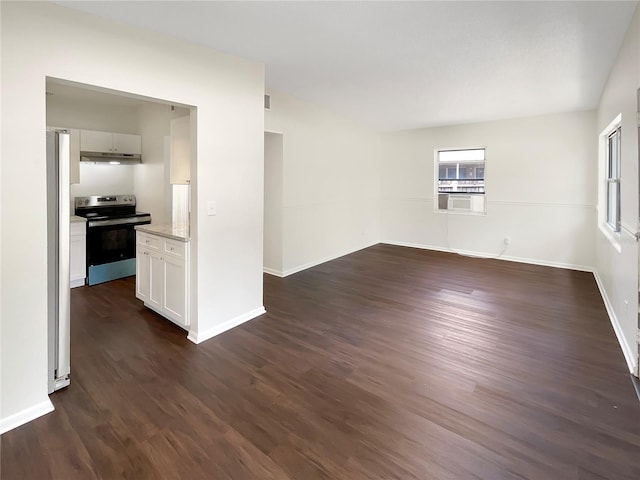 empty room with dark hardwood / wood-style flooring and cooling unit