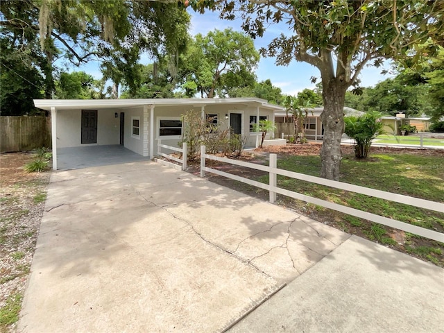 single story home with a carport