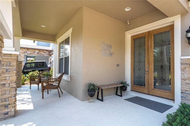 property entrance featuring french doors