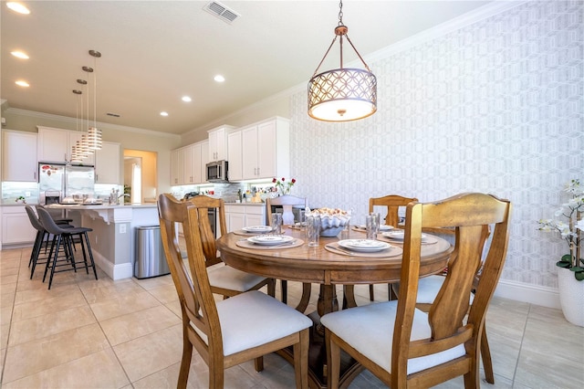 tiled dining area with crown molding