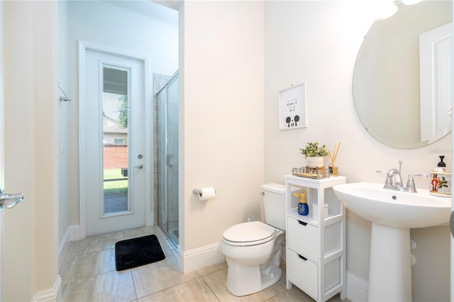 bathroom with walk in shower, tile patterned flooring, and toilet