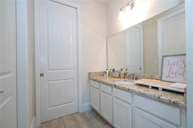 bathroom with vanity and tile patterned floors