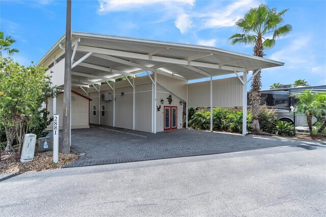 view of vehicle parking with a carport