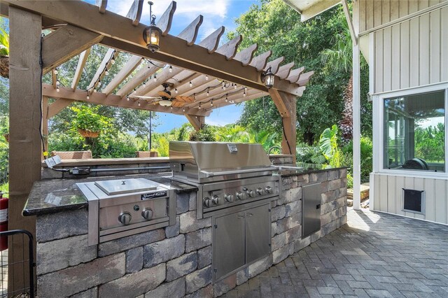 view of patio with a pergola and area for grilling