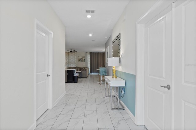 corridor with light tile patterned floors