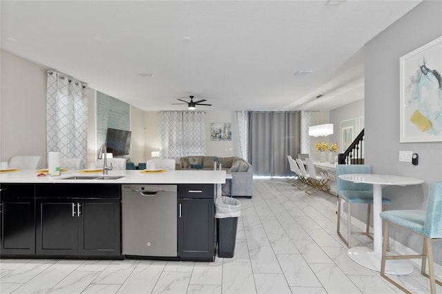 kitchen with sink, stainless steel dishwasher, and ceiling fan