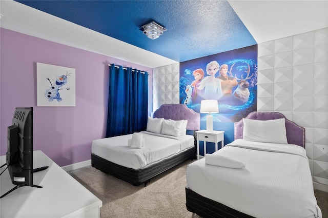 bedroom featuring carpet and a textured ceiling