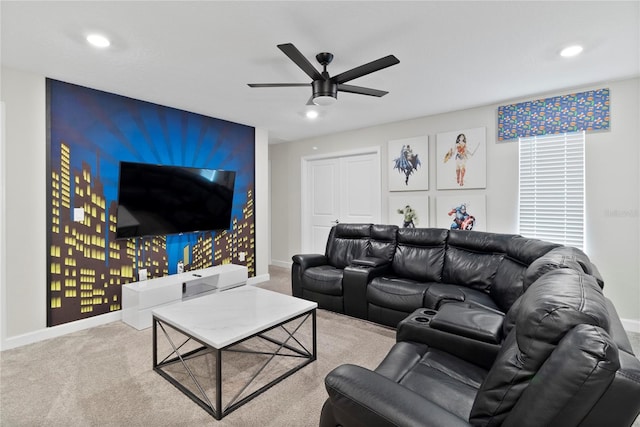 living room featuring carpet flooring and ceiling fan