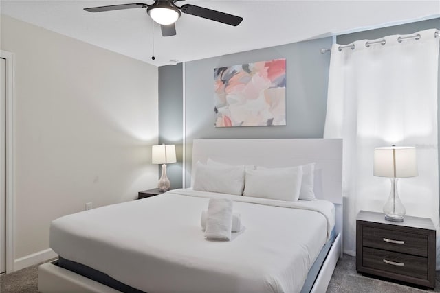 bedroom with ceiling fan and carpet floors