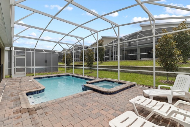 view of pool featuring a yard, a lanai, a patio, and an in ground hot tub