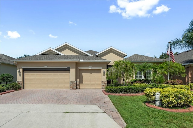 view of front of home featuring a garage and a front yard