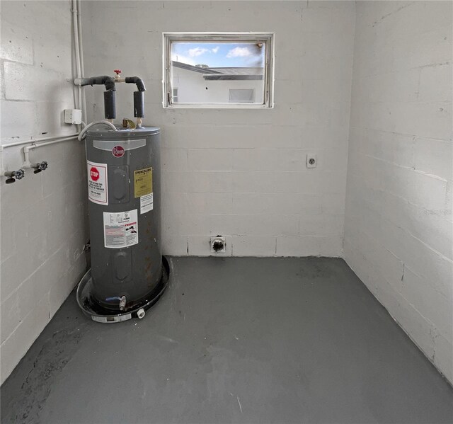 utility room featuring electric water heater