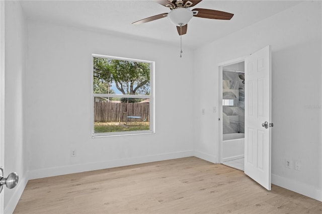 unfurnished room with light hardwood / wood-style floors, ceiling fan, and plenty of natural light