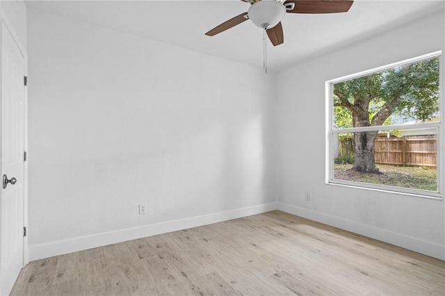 spare room with light hardwood / wood-style floors and ceiling fan