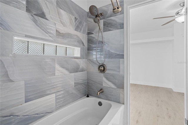 bathroom with tiled shower / bath, ceiling fan, and hardwood / wood-style floors