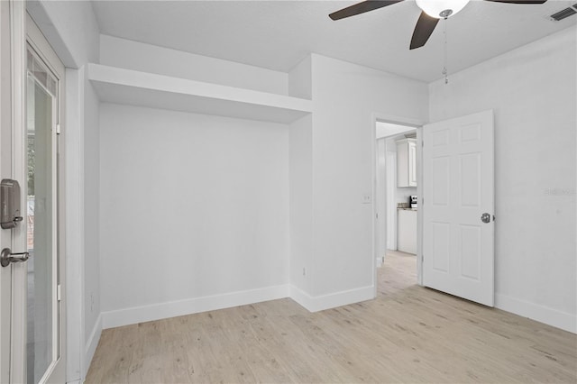 unfurnished room featuring light hardwood / wood-style floors and ceiling fan