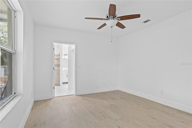 spare room featuring ceiling fan and light hardwood / wood-style floors