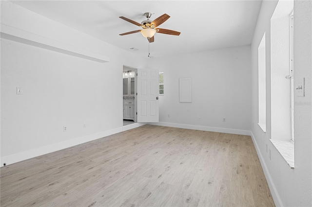 empty room featuring light hardwood / wood-style flooring and ceiling fan