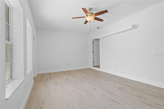 spare room with light hardwood / wood-style floors and ceiling fan