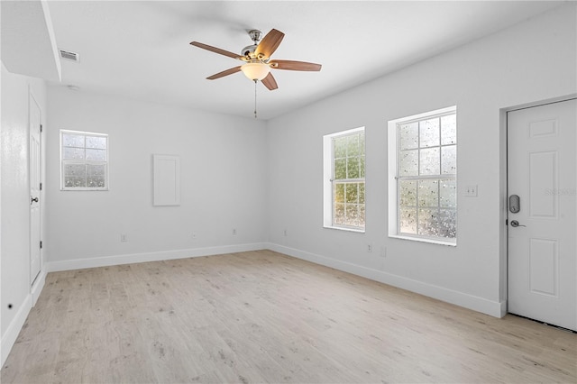 empty room featuring light hardwood / wood-style floors and ceiling fan