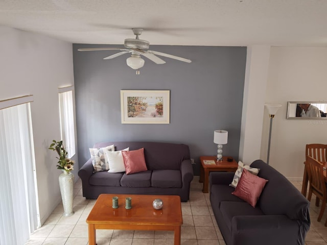 living room with ceiling fan and light tile patterned floors