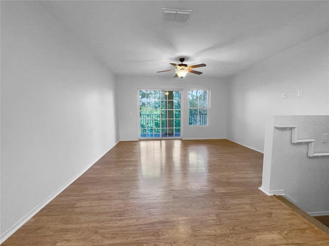 spare room featuring ceiling fan and wood-type flooring