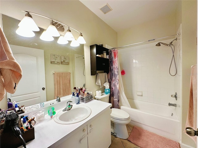 full bathroom featuring tile patterned flooring, vanity, shower / tub combo, and toilet