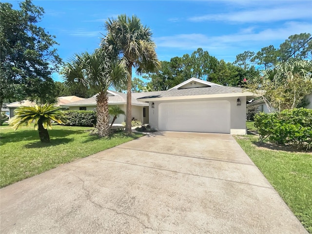 single story home featuring a garage and a front yard