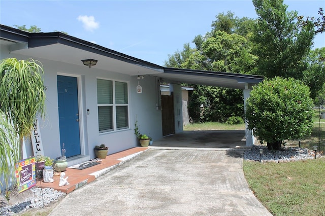 exterior space with a carport