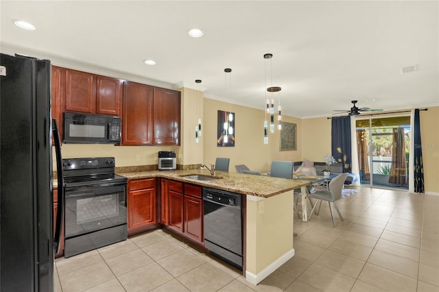 kitchen with black appliances, sink, kitchen peninsula, light stone countertops, and ceiling fan