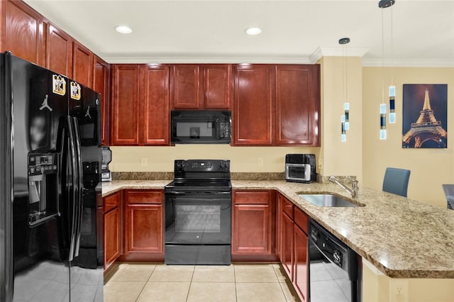 kitchen featuring light tile patterned flooring, kitchen peninsula, black appliances, light stone countertops, and decorative light fixtures